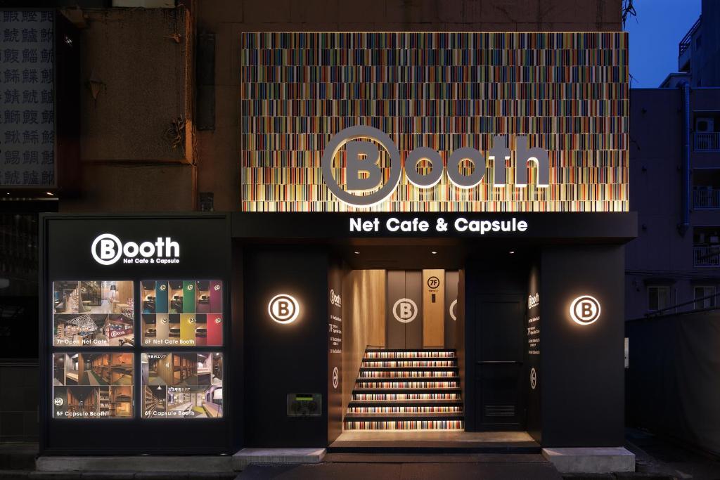 a store front of a door with a sign on it at Booth Netcafe & Capsule in Tokyo