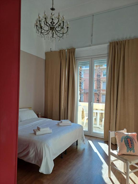 Posteľ alebo postele v izbe v ubytovaní Albergo Malibu
