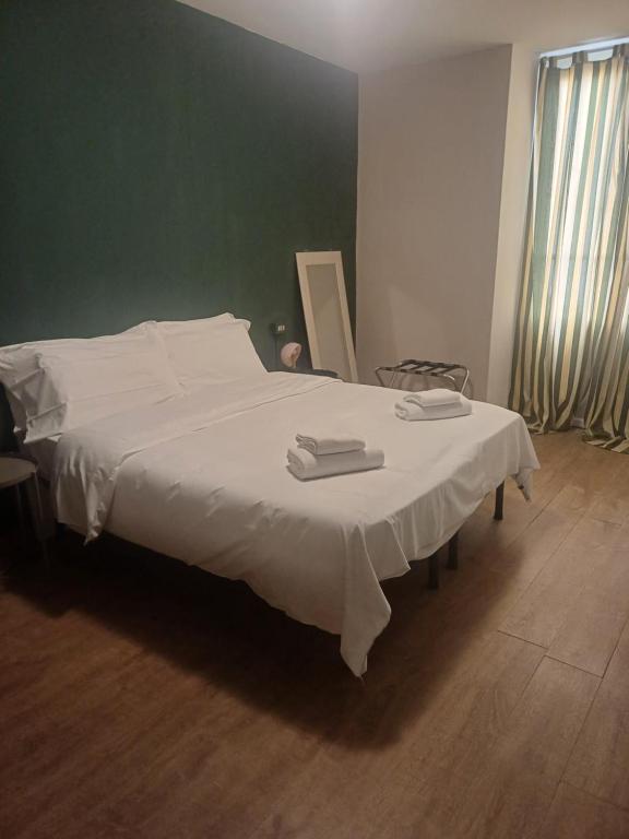 Posteľ alebo postele v izbe v ubytovaní Albergo Malibu