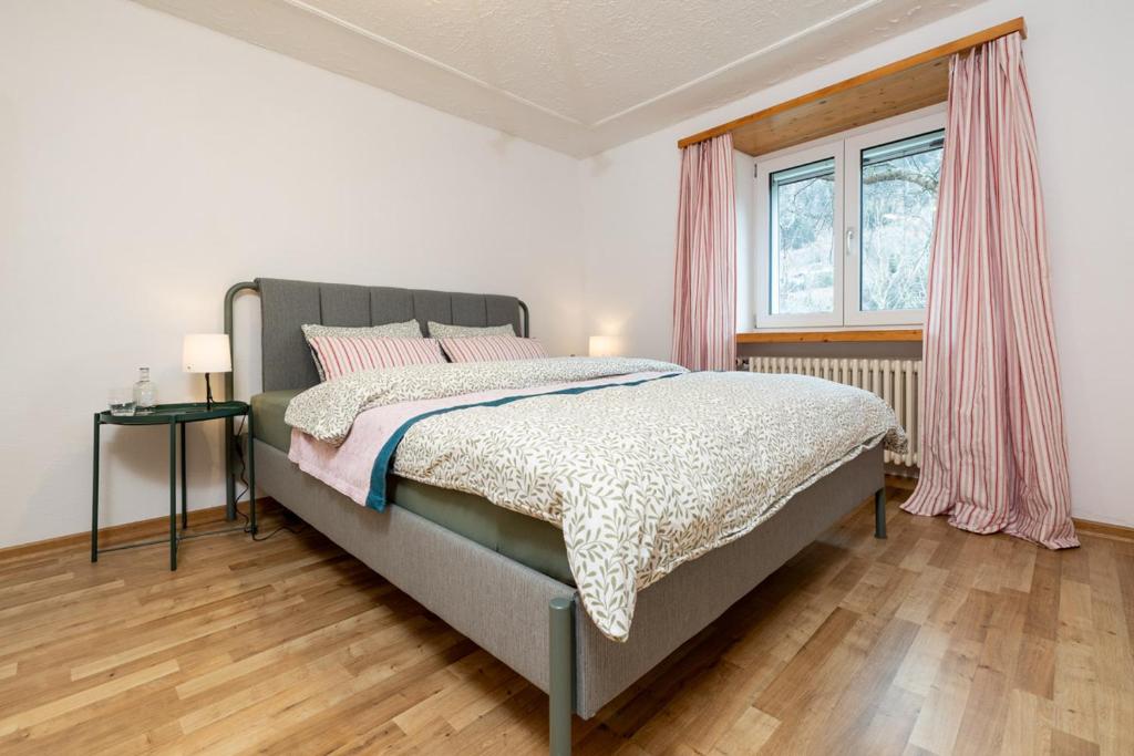 Postel nebo postele na pokoji v ubytování Perla Grischuna