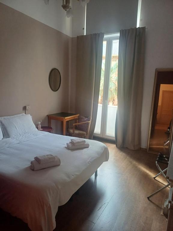 Posteľ alebo postele v izbe v ubytovaní Albergo Malibu