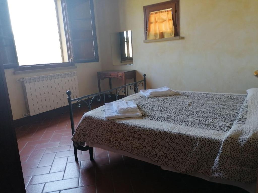 Postel nebo postele na pokoji v ubytování Residence Il Monastero