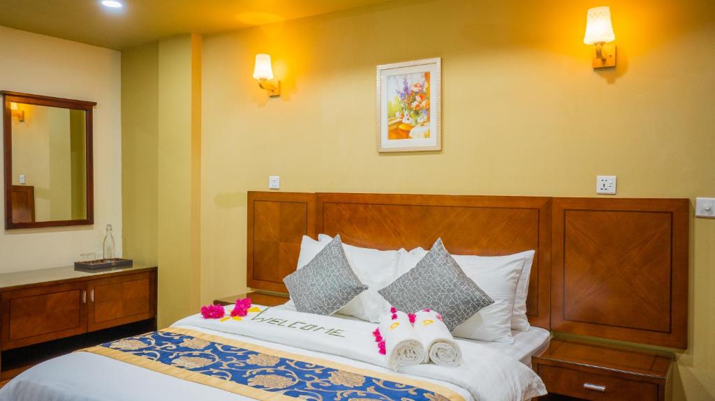 Postel nebo postele na pokoji v ubytování Blue Wave Hotel Maldives- Surf-fishing and beach -Free domestic transport when booked fullboard for a week