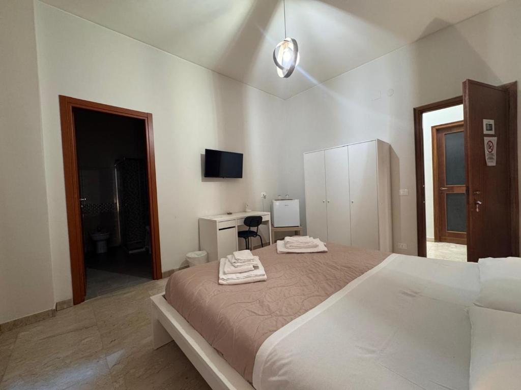 Postel nebo postele na pokoji v ubytování Vespro Guest House