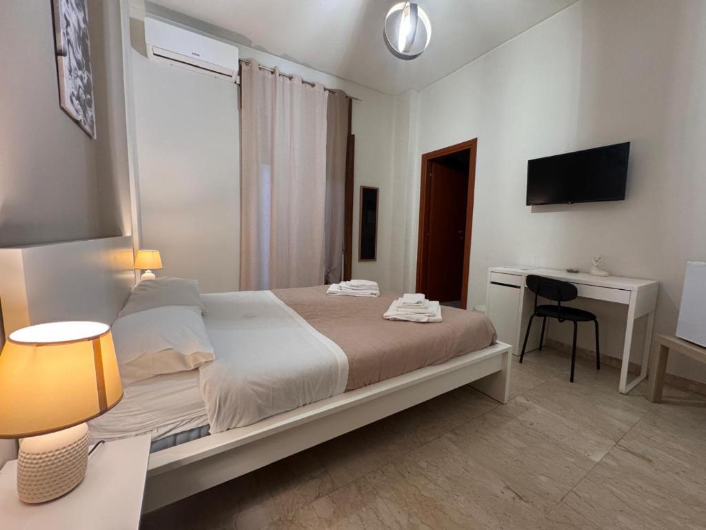 Postel nebo postele na pokoji v ubytování Vespro Guest House