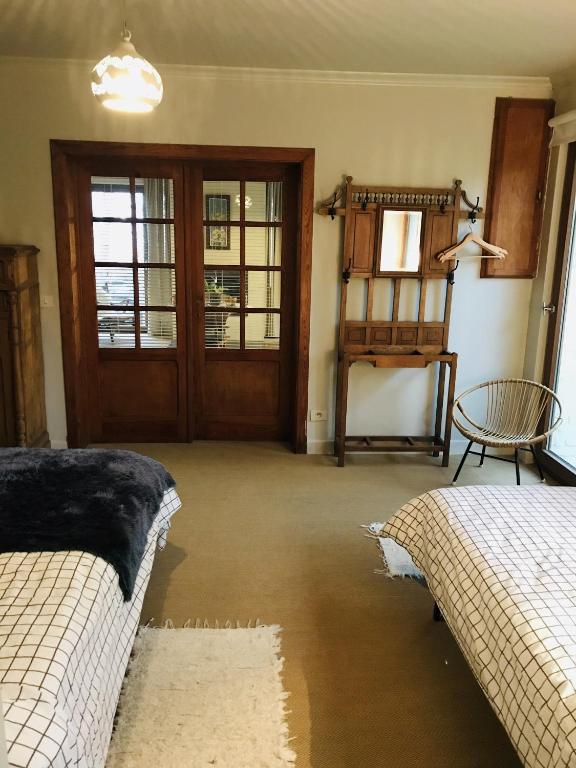 Postel nebo postele na pokoji v ubytování Panacée Guesthouses