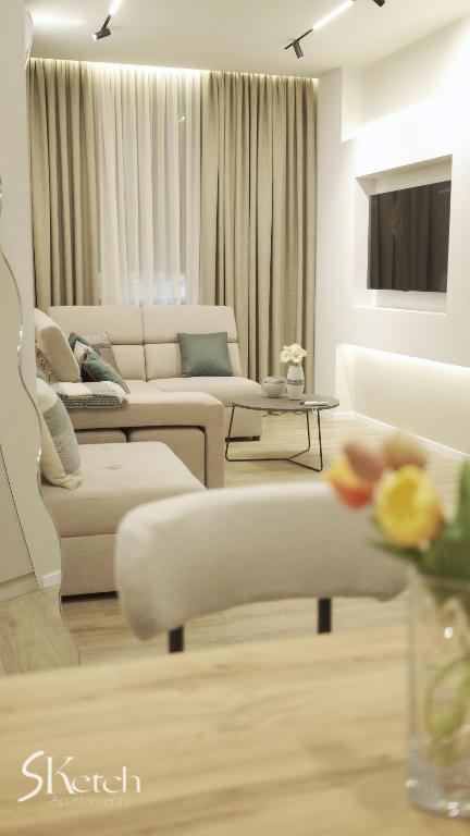 TV a/nebo společenská místnost v ubytování SKetch Apartments