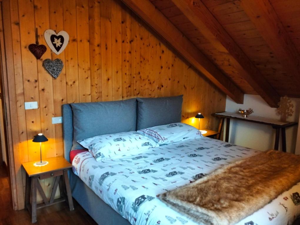 En eller flere senge i et værelse på Deliziosa mansarda con vista Dolomiti