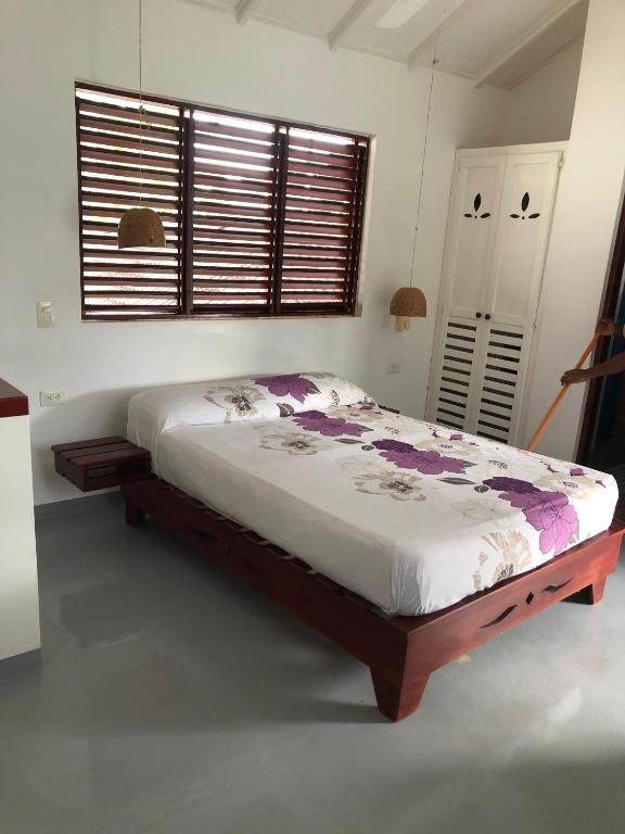 Postel nebo postele na pokoji v ubytování Hotel Casa Robinson
