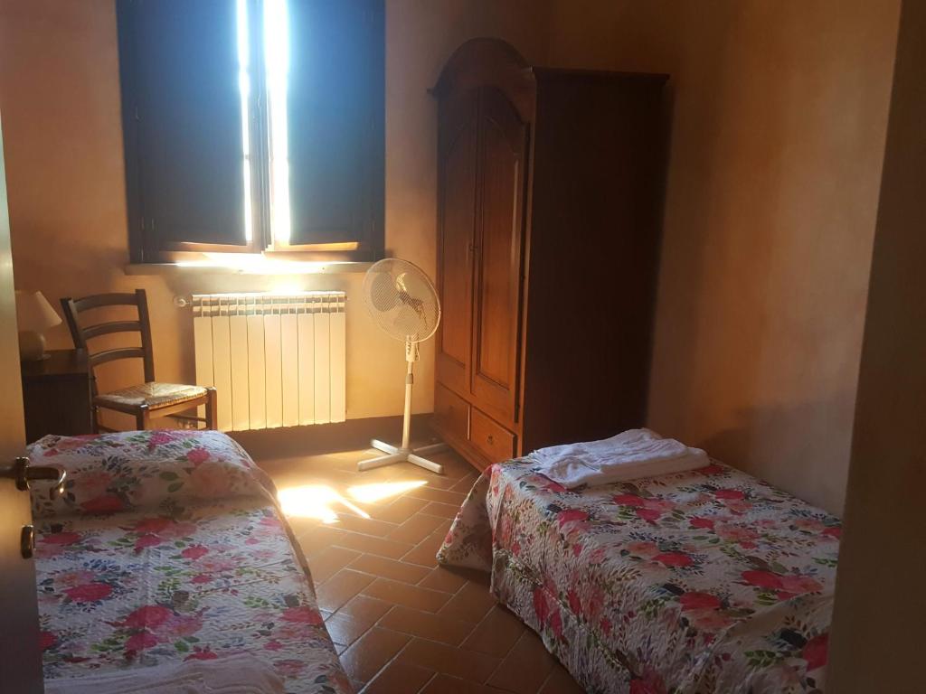 Postel nebo postele na pokoji v ubytování Residence Il Monastero