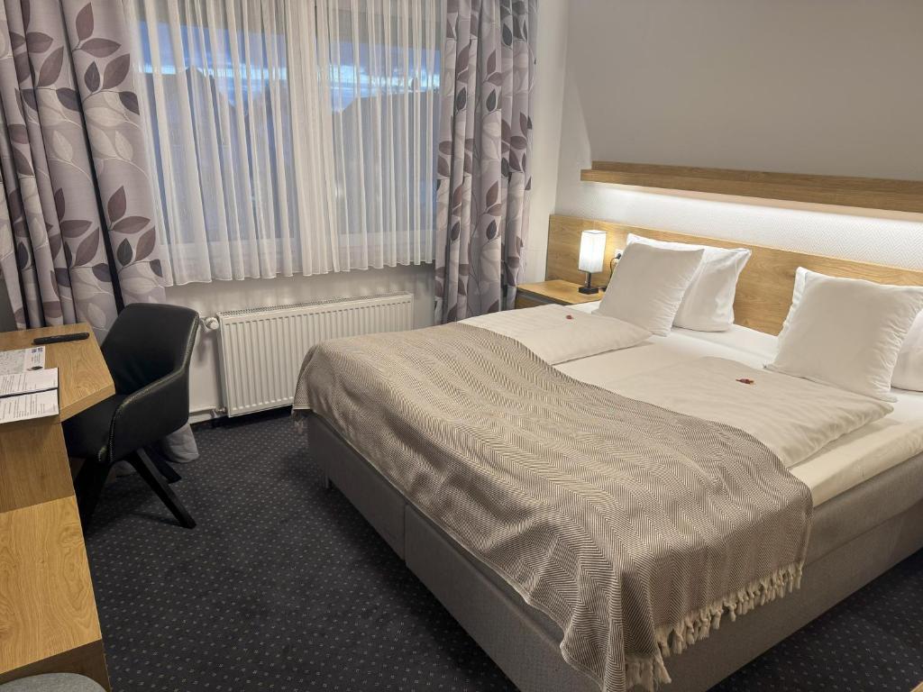 Postel nebo postele na pokoji v ubytování Hotel Zum Ritter