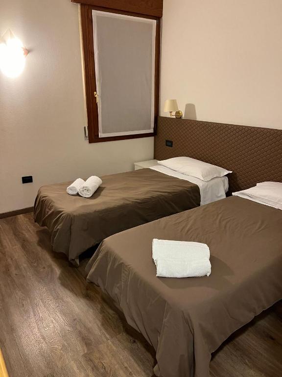 Postel nebo postele na pokoji v ubytování Damodoro Hotel