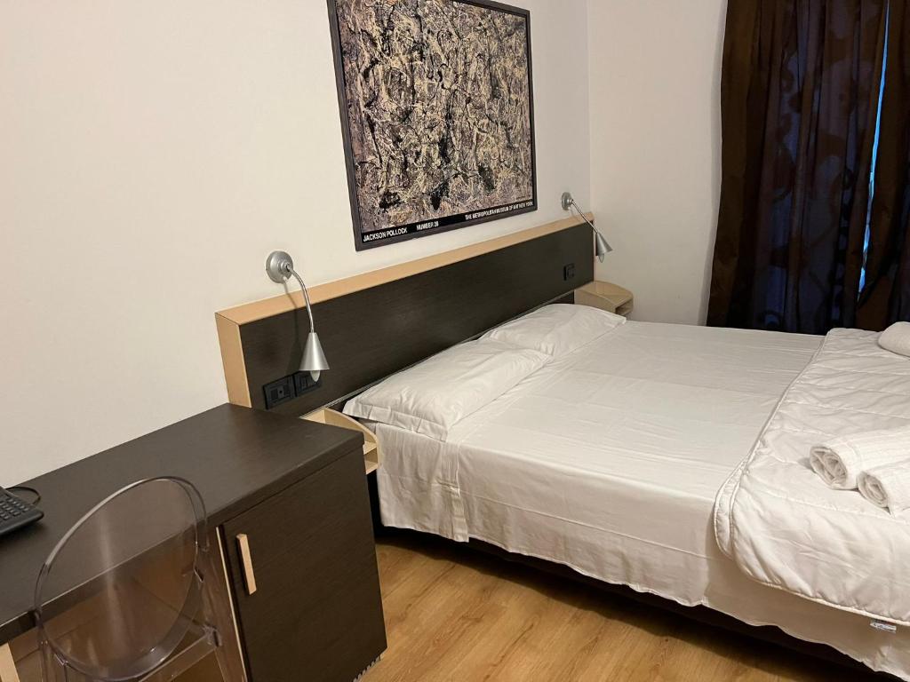 Postel nebo postele na pokoji v ubytování Damodoro Hotel