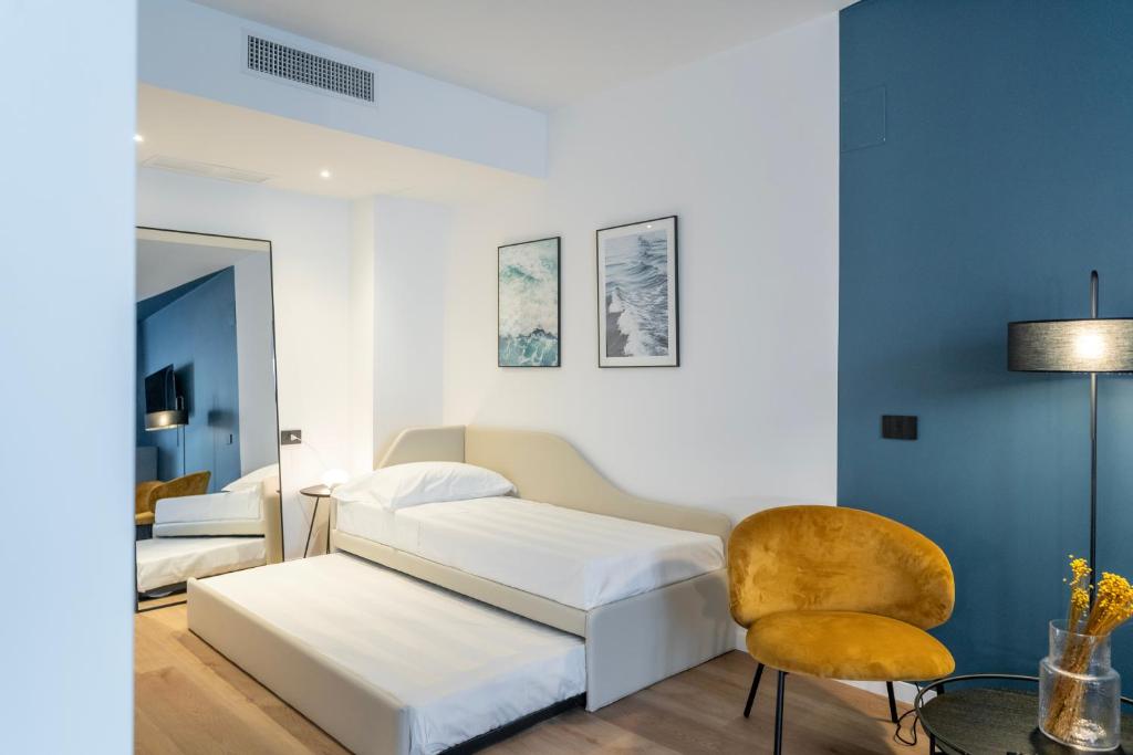 Postel nebo postele na pokoji v ubytování BISCARDI Hotel