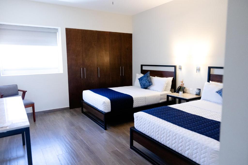 Postel nebo postele na pokoji v ubytování Hotel Refugio