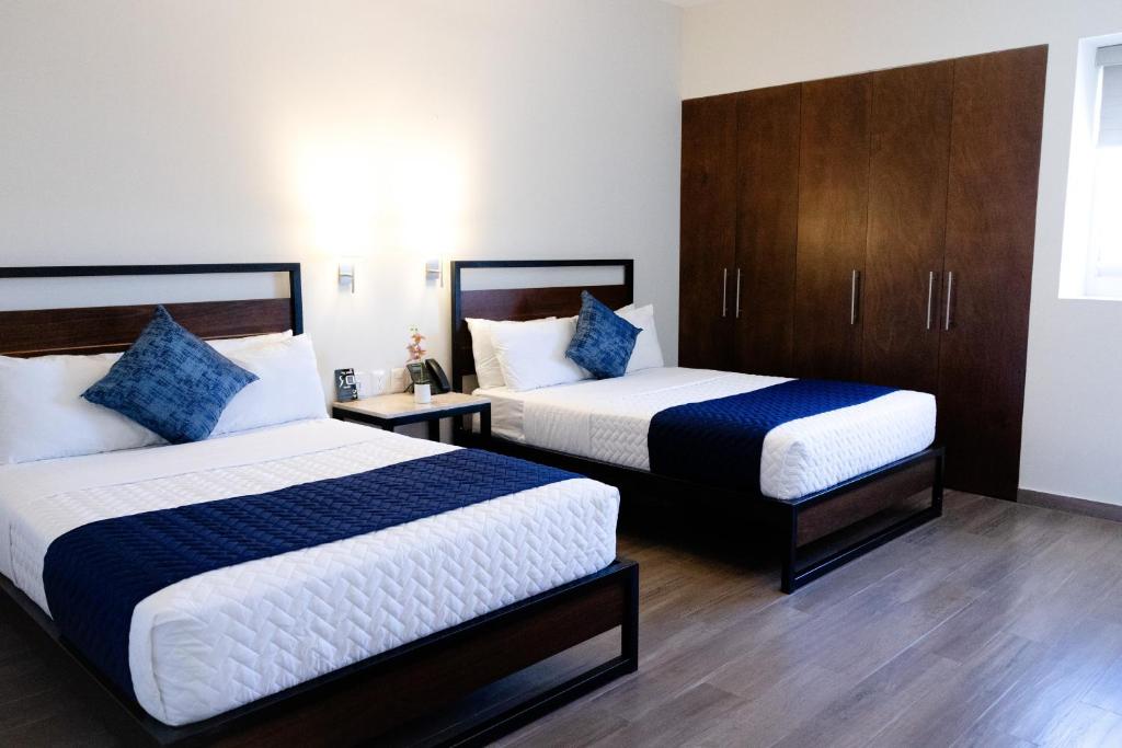 Postel nebo postele na pokoji v ubytování Hotel Refugio