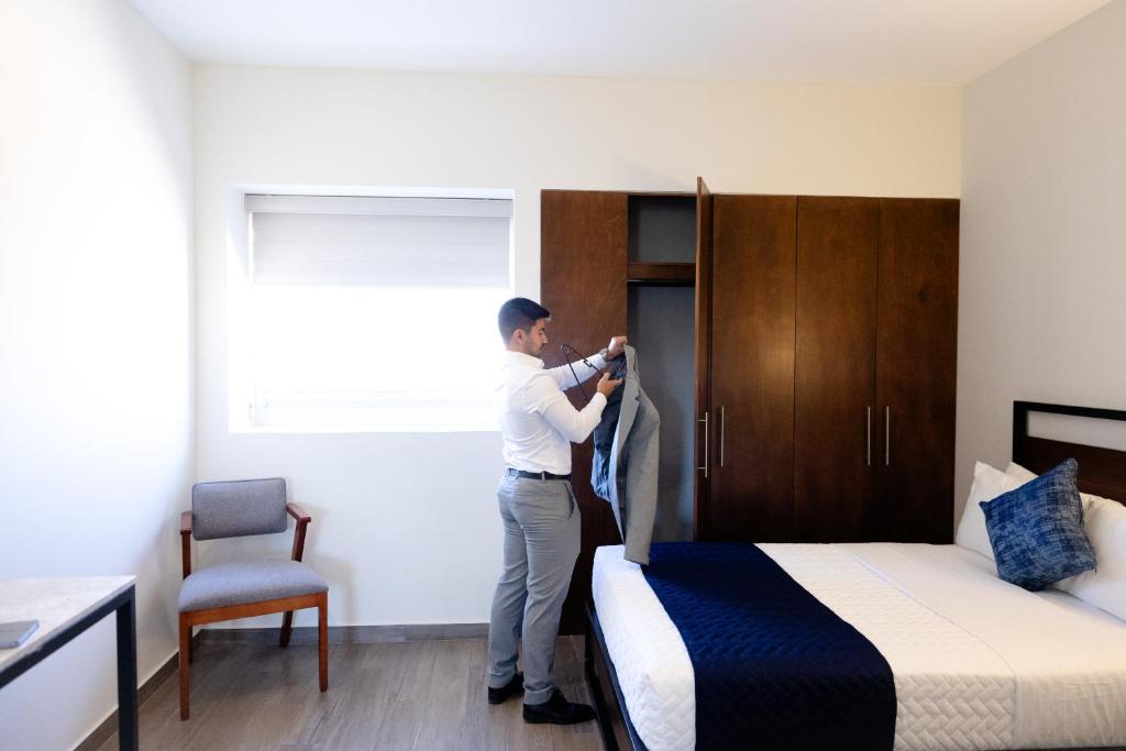 Postel nebo postele na pokoji v ubytování Hotel Refugio
