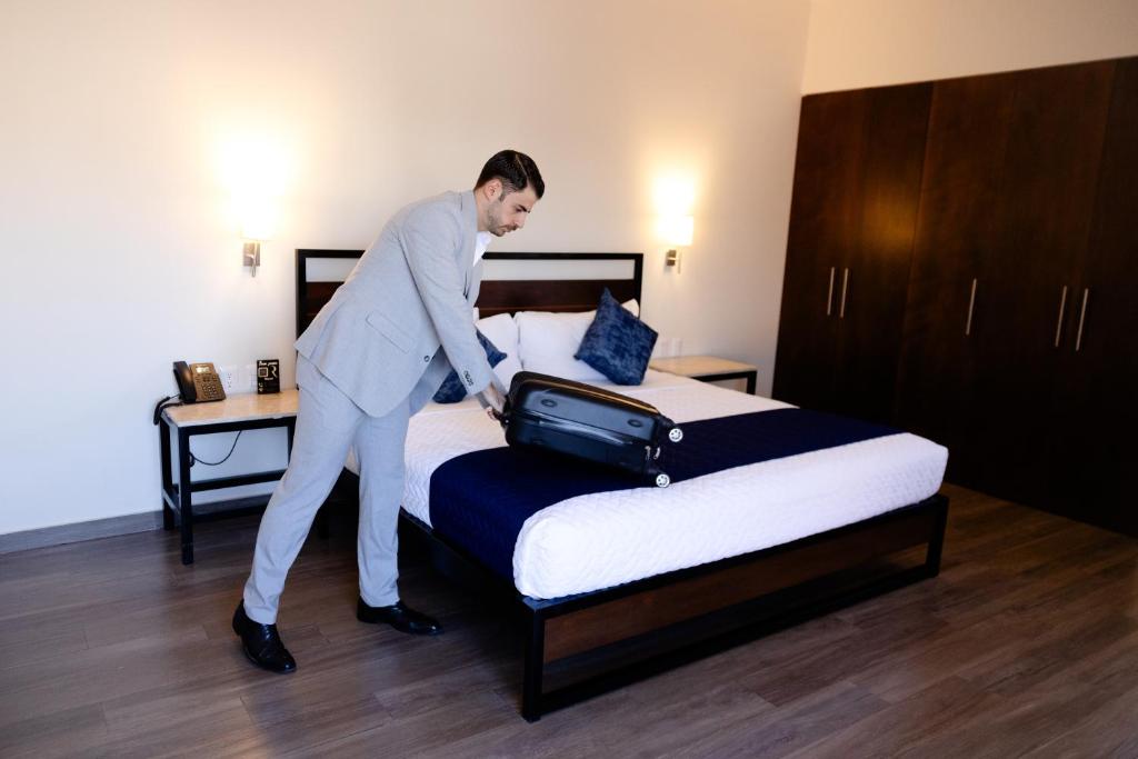 Postel nebo postele na pokoji v ubytování Hotel Refugio