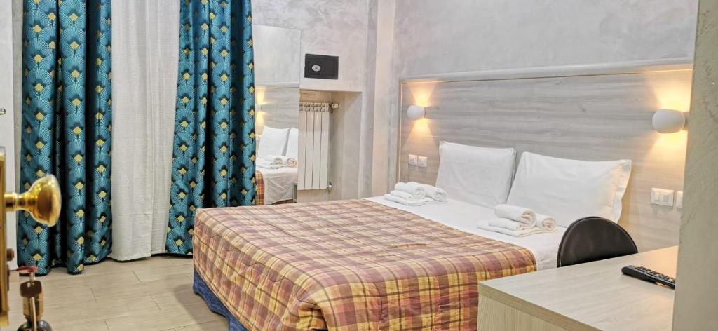 A bed or beds in a room at Hotel Orchidea
