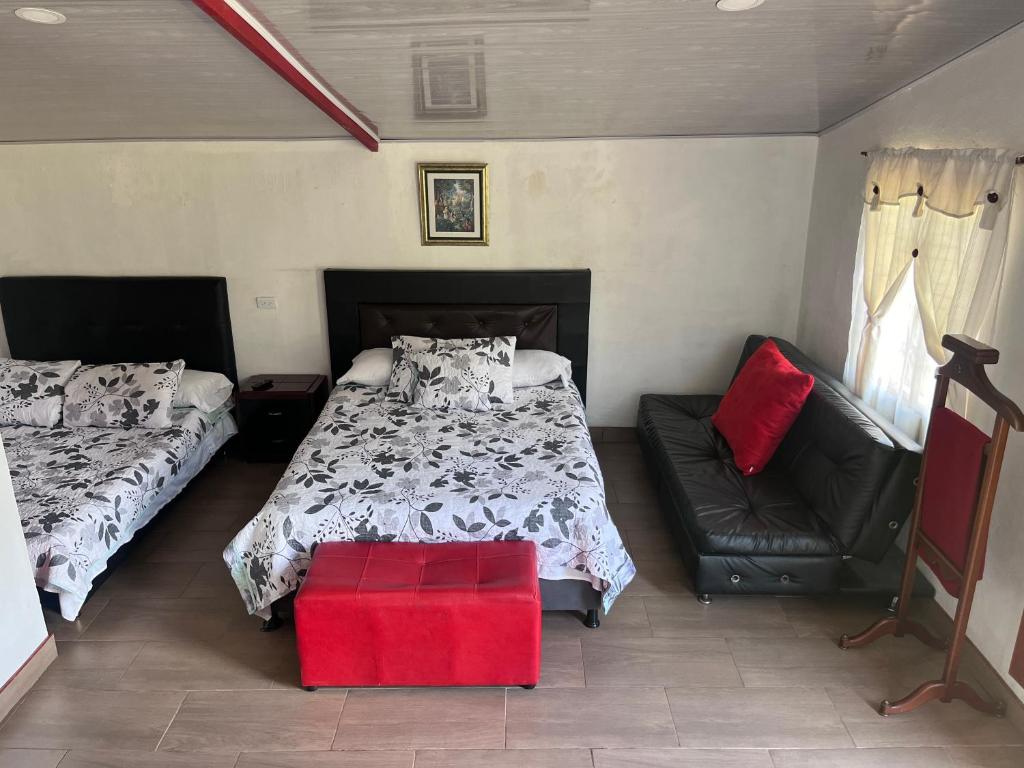 Postel nebo postele na pokoji v ubytování Cabaña Campestre Miraluna