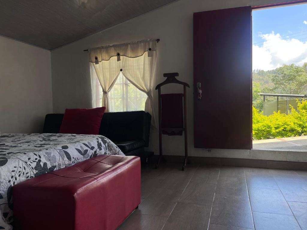 Postel nebo postele na pokoji v ubytování Cabaña Campestre Miraluna