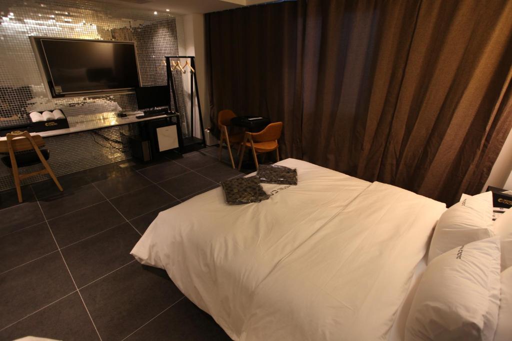 Postel nebo postele na pokoji v ubytování Hotel Cacao