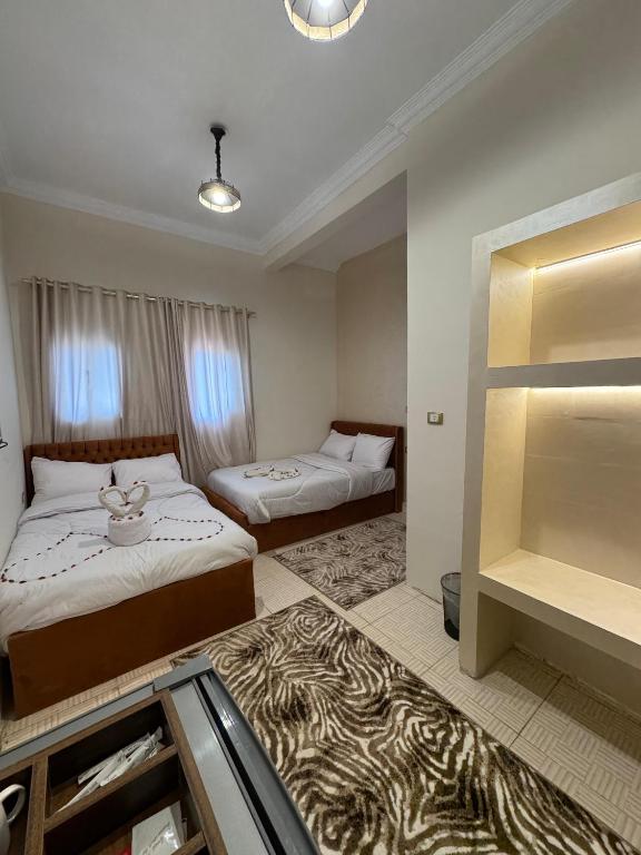 Postel nebo postele na pokoji v ubytování King hur pyramids inn