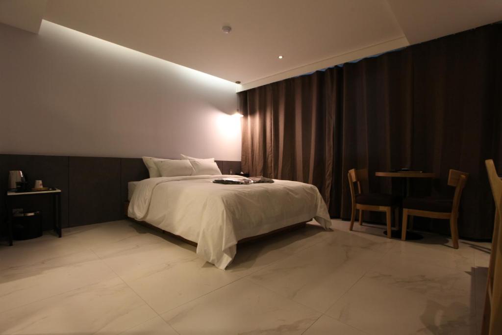 Postel nebo postele na pokoji v ubytování Hotel Cacao