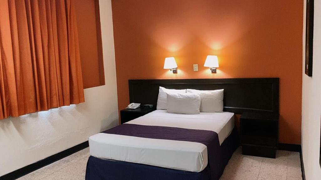 Postel nebo postele na pokoji v ubytování HOTEL ValgrandE