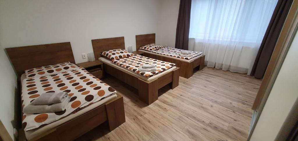Postel nebo postele na pokoji v ubytování Ubytovanie HK