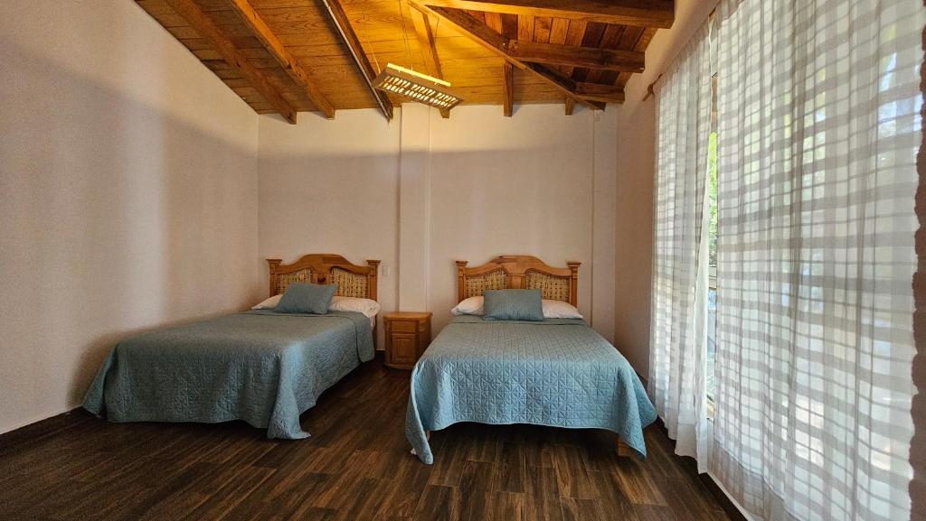 Letto o letti in una camera di Los Temazcales de Xochitepec
