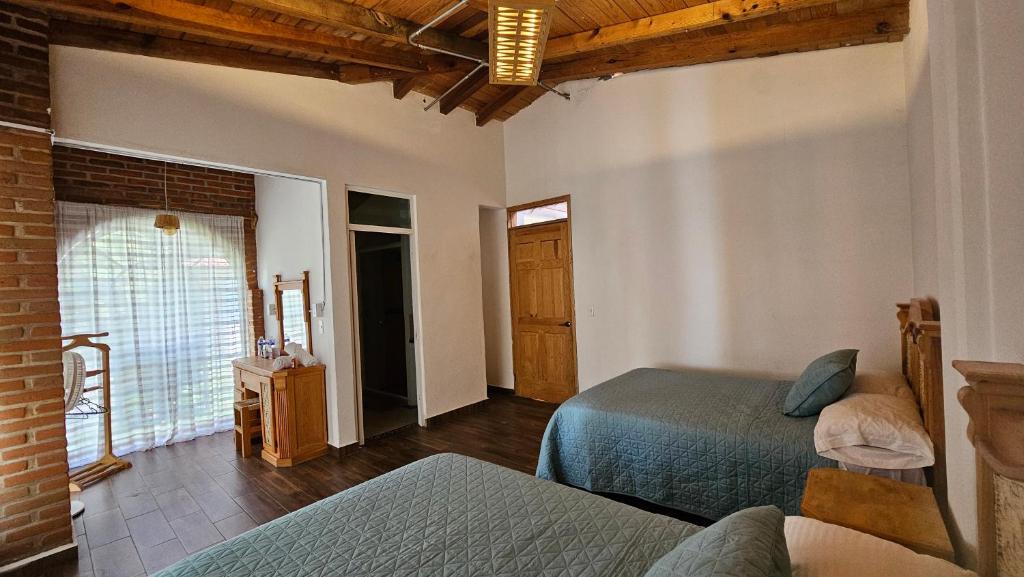 Letto o letti in una camera di Los Temazcales de Xochitepec