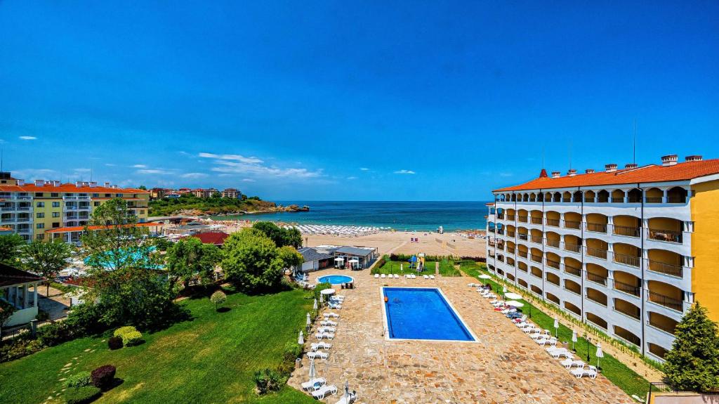 a hotel with a swimming pool and a beach at ApartReginaCarevo in Tsarevo