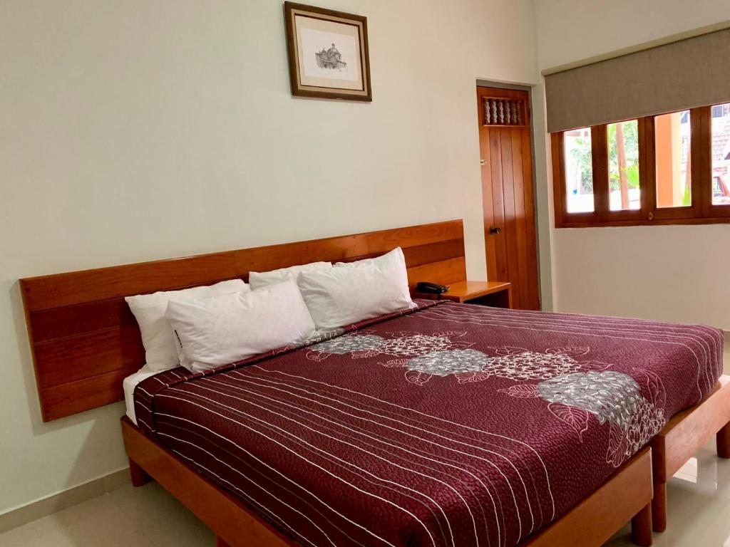 Postel nebo postele na pokoji v ubytování HOTEL POSADA DEL SOL