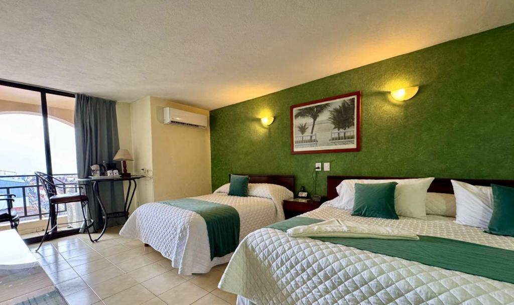 Postel nebo postele na pokoji v ubytování Hotel Bello Cordoba