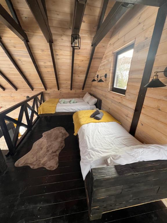 Postel nebo postele na pokoji v ubytování Bungalux Kopaonik
