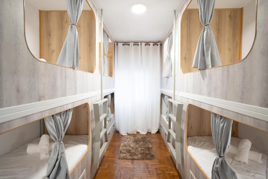 a room with two bunk beds and a window at La posada in Porriño