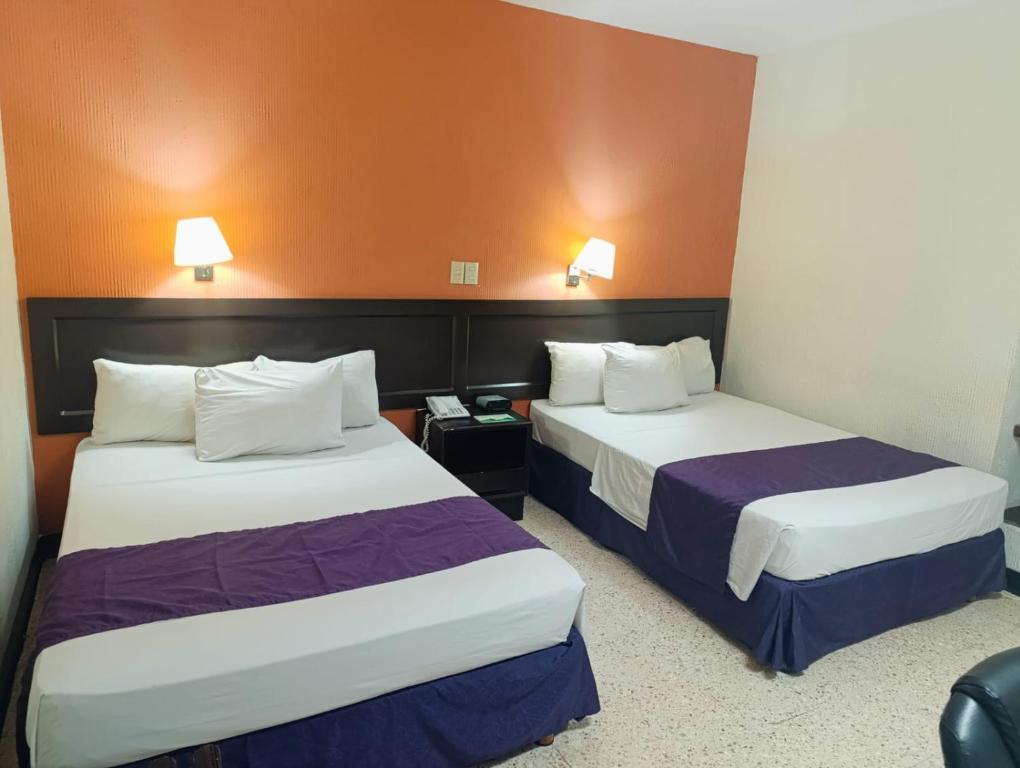 Postel nebo postele na pokoji v ubytování HOTEL ValgrandE