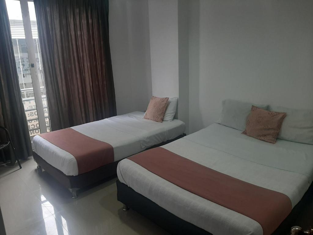 Voodi või voodid majutusasutuse Hotel Aussie koala toas