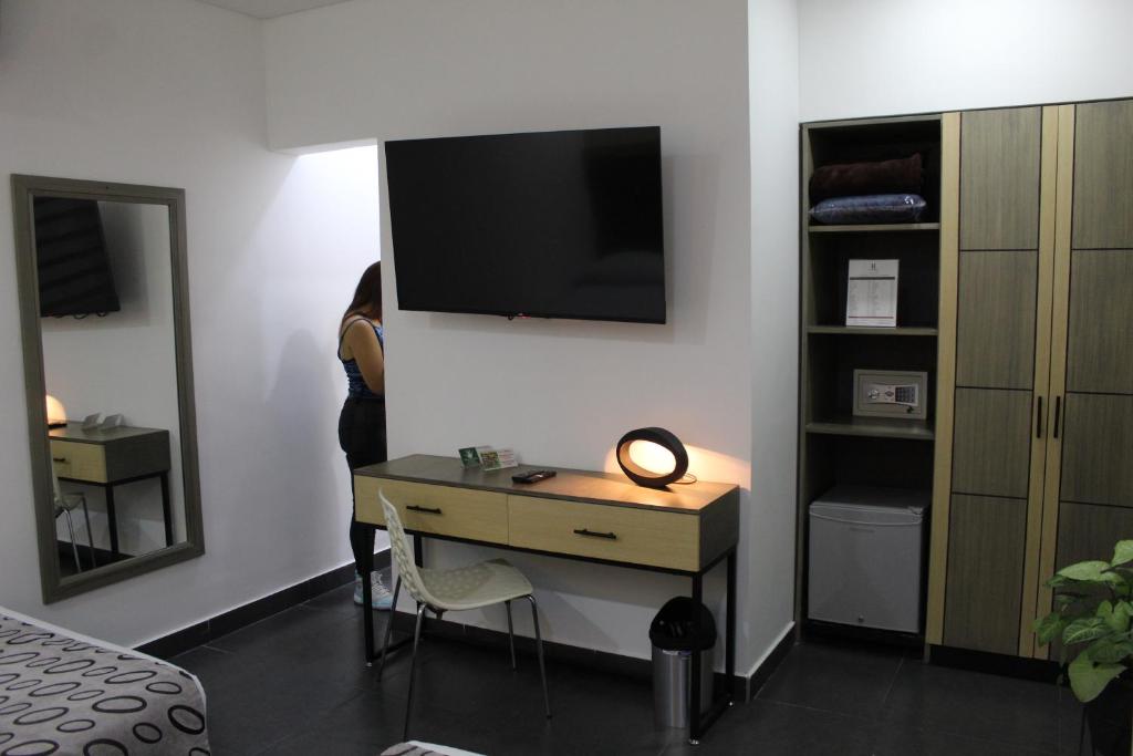 TV a/nebo společenská místnost v ubytování Hotel Merlott Lleras