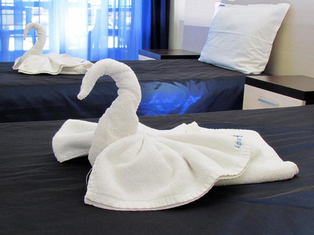 Postel nebo postele na pokoji v ubytování Afrodita Hotel