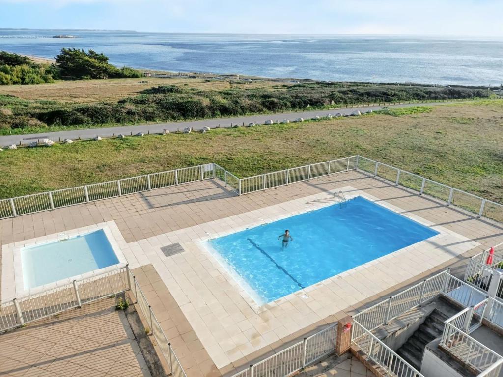 Bazén v ubytovaní Appartement vue mer et piscine à Guidel - 42m² - Tennis alebo v jeho blízkosti