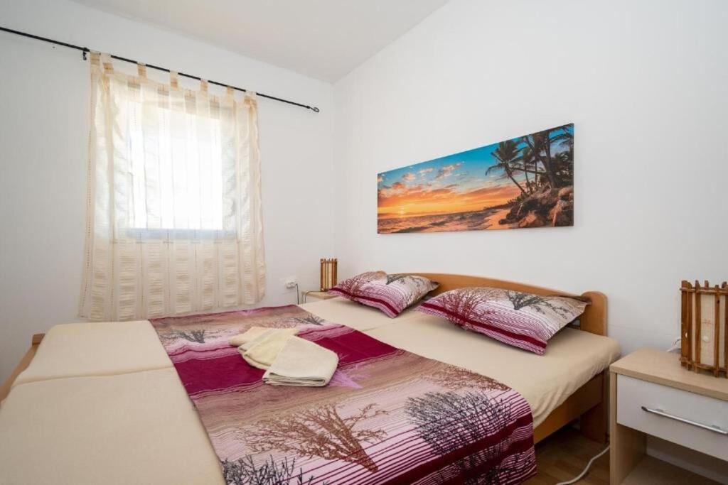 Posteľ alebo postele v izbe v ubytovaní Apartments Gavro