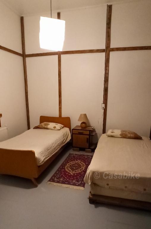 Postel nebo postele na pokoji v ubytování Casa Bike
