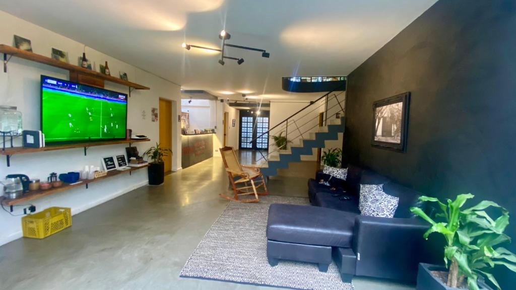 TV a/nebo společenská místnost v ubytování Casa Mosaiko Primer Parque Laureles