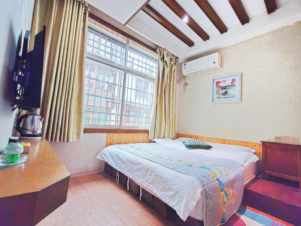 Postel nebo postele na pokoji v ubytování Lumingju Homestay