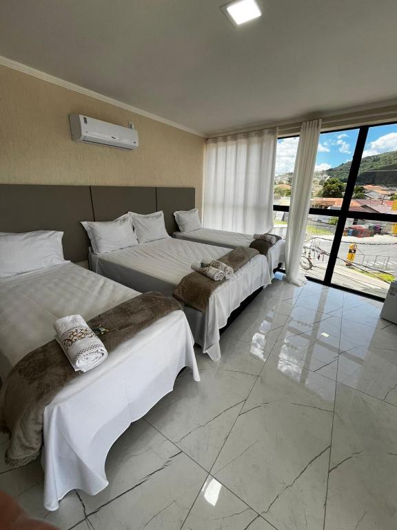 Postel nebo postele na pokoji v ubytování Hotel Aris
