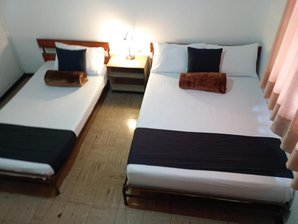 Postel nebo postele na pokoji v ubytování Hotel Alpino Armenia