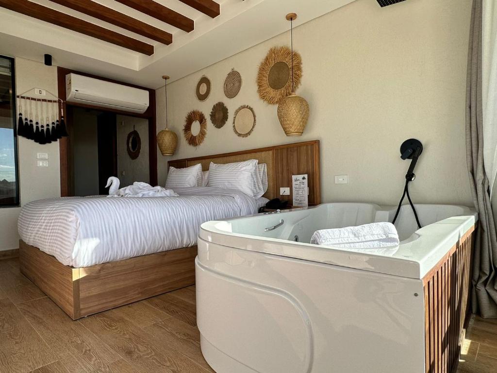 Voodi või voodid majutusasutuse Galaxy Pyramids View INN toas