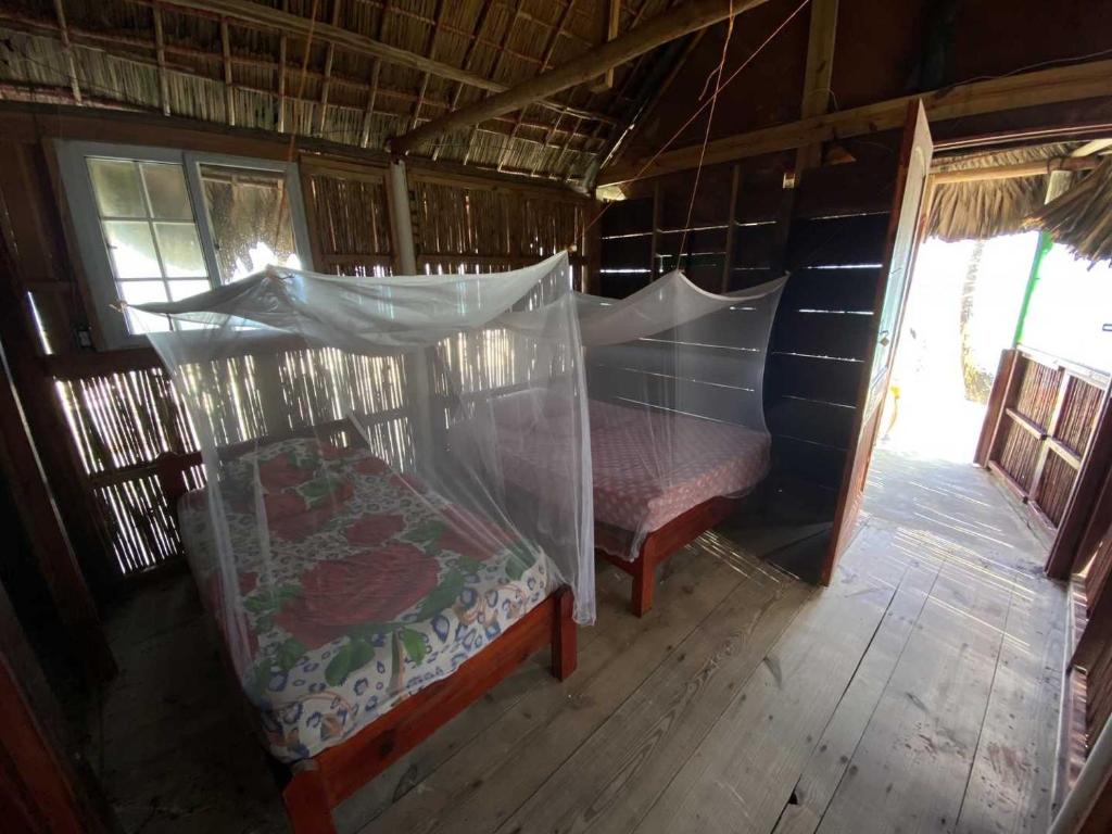 Postel nebo postele na pokoji v ubytování Cabaña privada en las islas de San blas Aroma